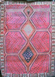 A vintage Oriental area rug with