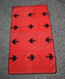 A vintage woven red wool blanket, highlighted