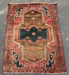 A vintage Oriental area rug with