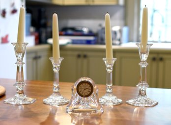 Two pairs of crystal candlesticks,