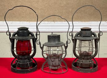 Three antique railroad lanterns