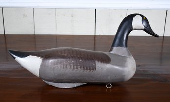 A vintage carved and painted goose