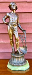 Vintage hollow metal sculpture of farmer