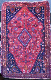 A vintage Oriental area rug, a