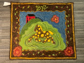 A 20th C. hooked wool mat, depicting