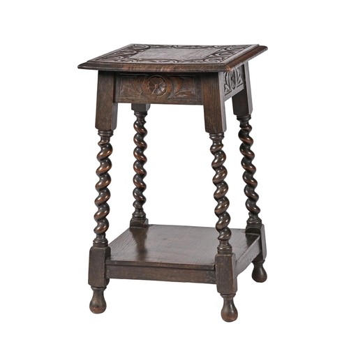 A carved oak occasional table  3c8c83