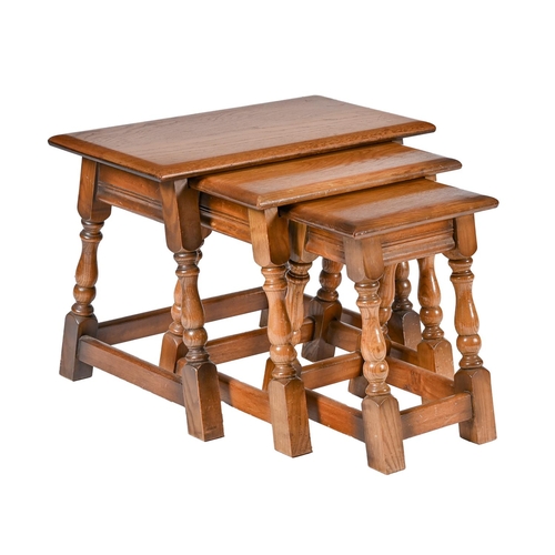 An oak nest of tables, 46cm h;