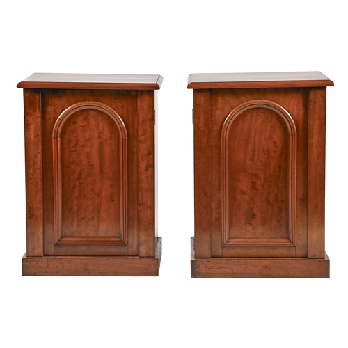 A pair of mahogany bedside cupboards,