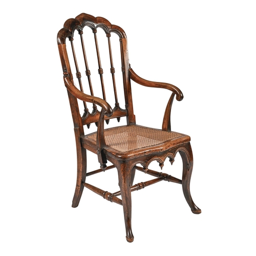 A solid walnut gothic style armchair,