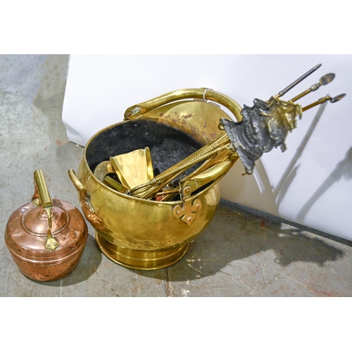 A brass coal scuttle, with swing