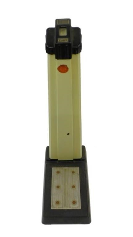 A STANDING PENNY SCALE. BLACK AND