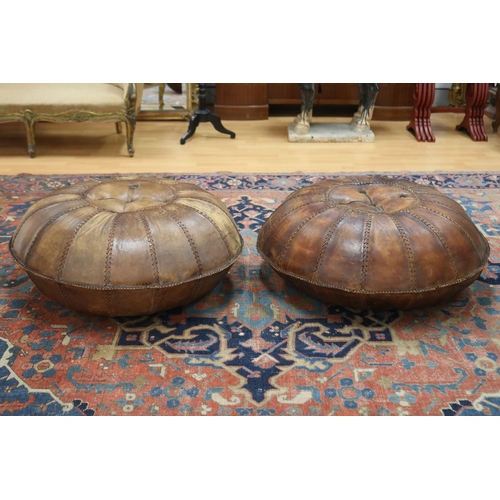 Pair of large leather ottomans,