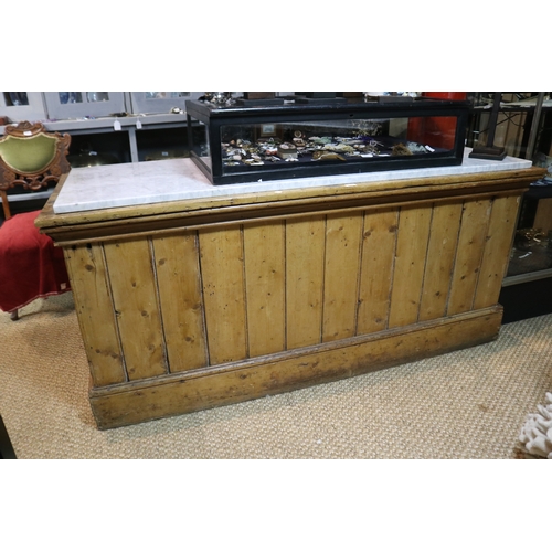 Pine shop counter with white marble