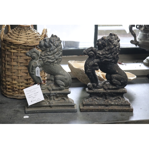 Pair of cast iron rampant lions,