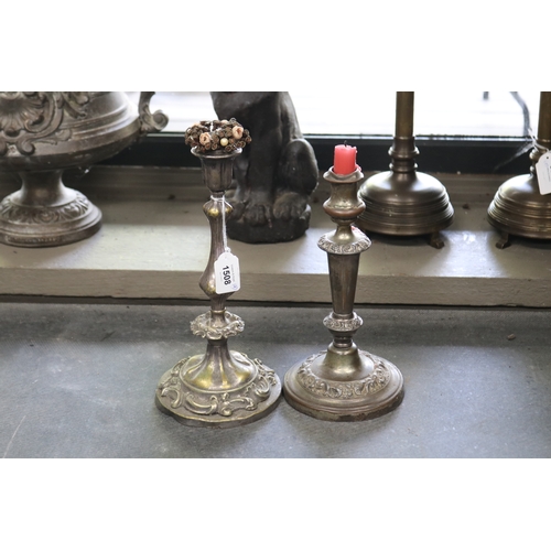 Two antique Sheffield plate candlesticks,