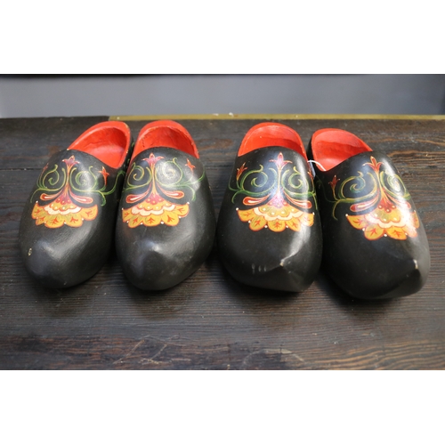 Two Pairs of hand painted wooden clogs,