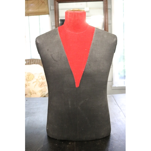 Black and red male mannequin torso,