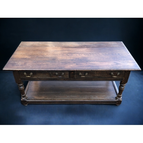 A VINTAGE HARDWOOD COFFEE TABLE.