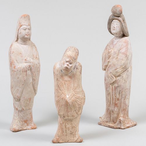 THREE CHINESE POTTERY TOMB FIGURESThe