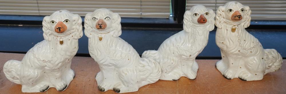 FOUR STAFFORDSHIRE POTTERY SPANIELS,