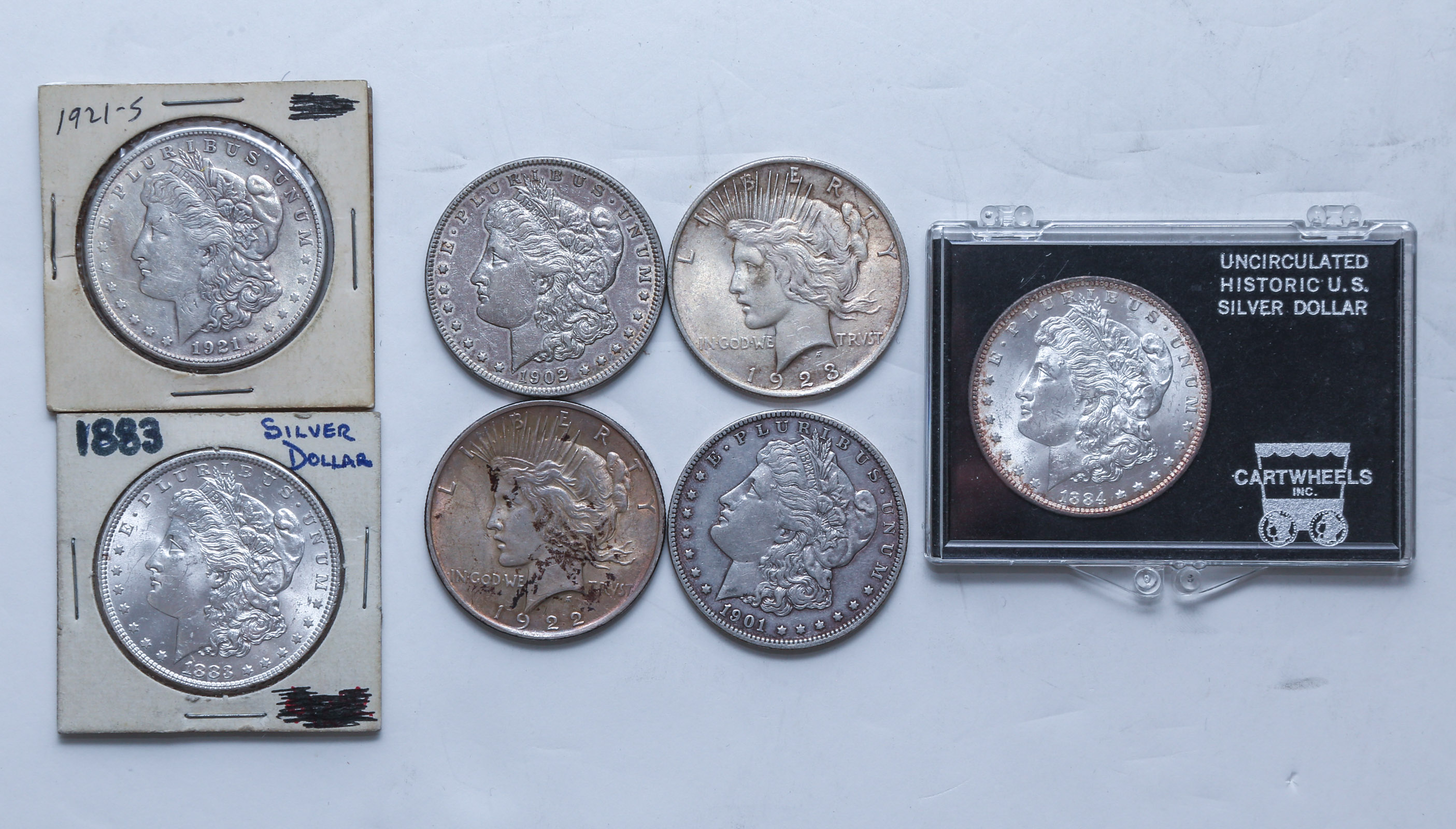 SEVEN US SILVER DOLLARS WITH 2