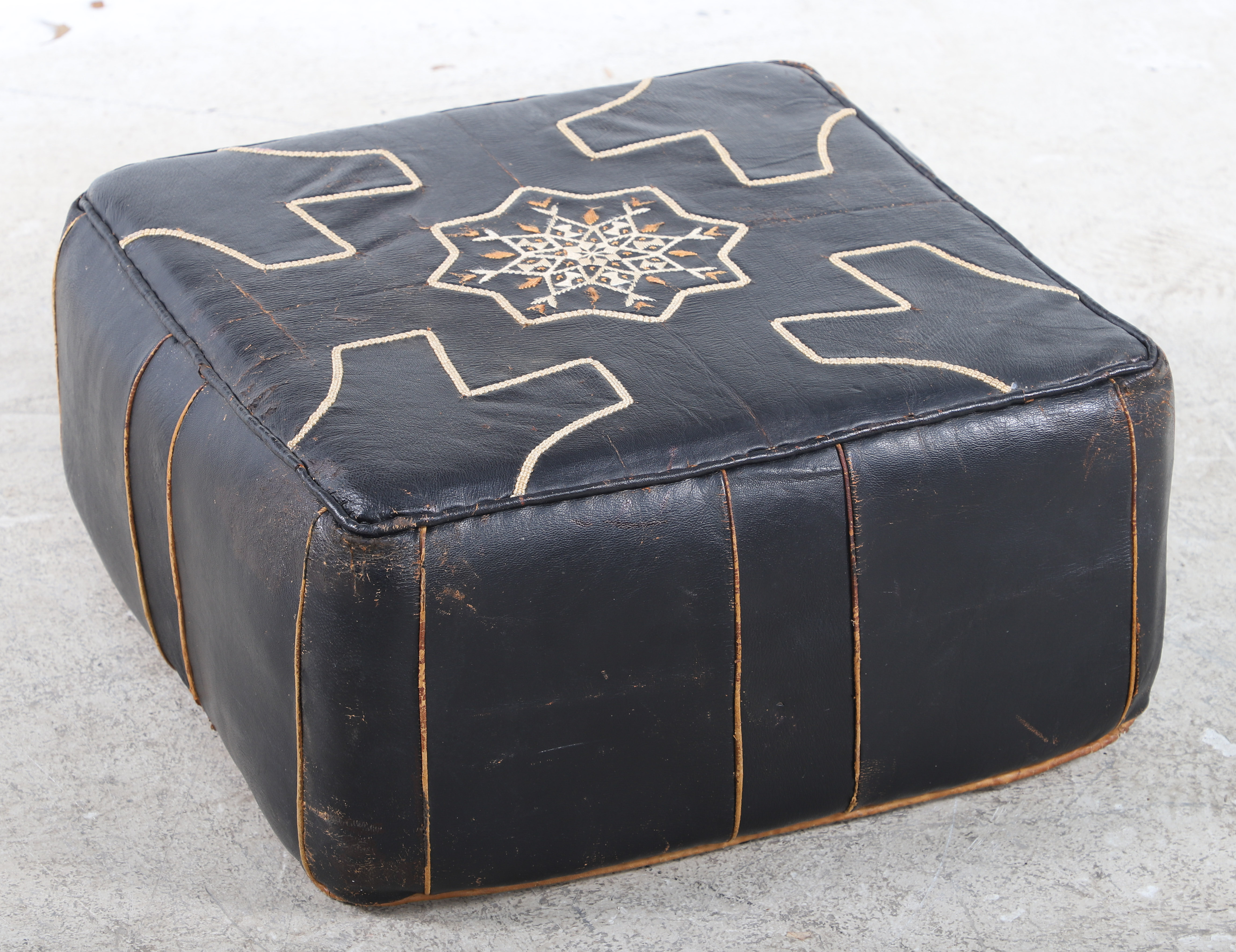 Asian style stitched leather ottoman  3ca7a3