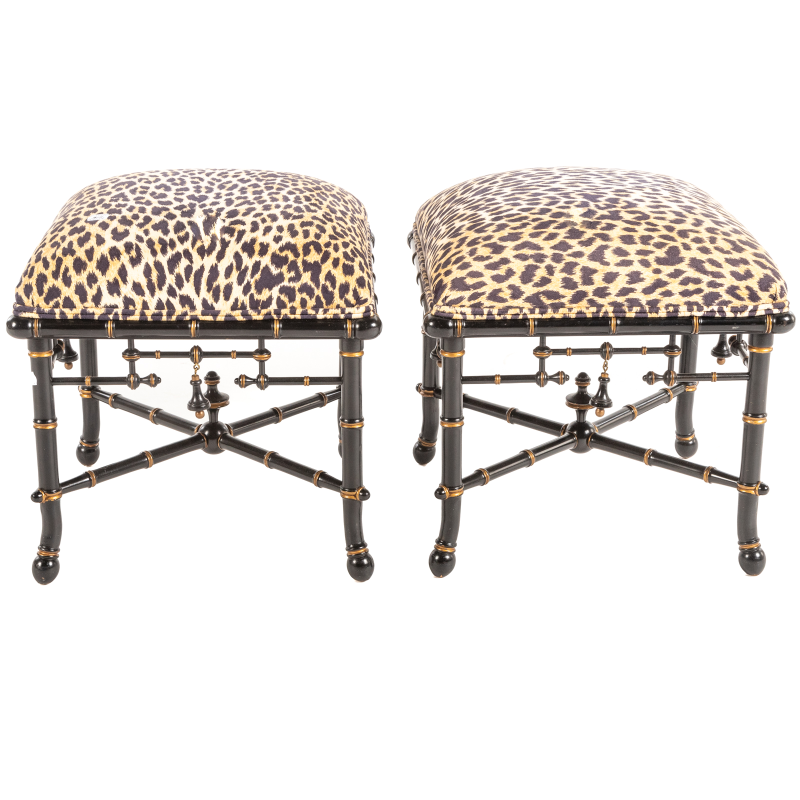 A PAIR OF BAKER EBONIZED FOOTSTOOLS