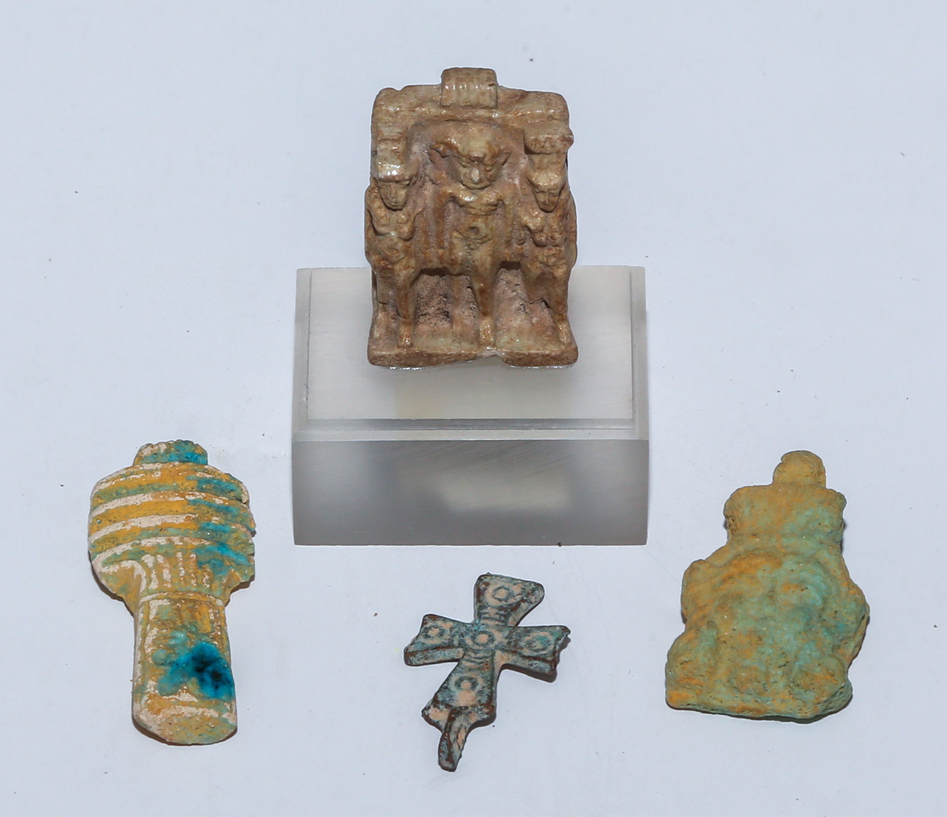 FOUR EGYPTIAN AMULETS All pierced