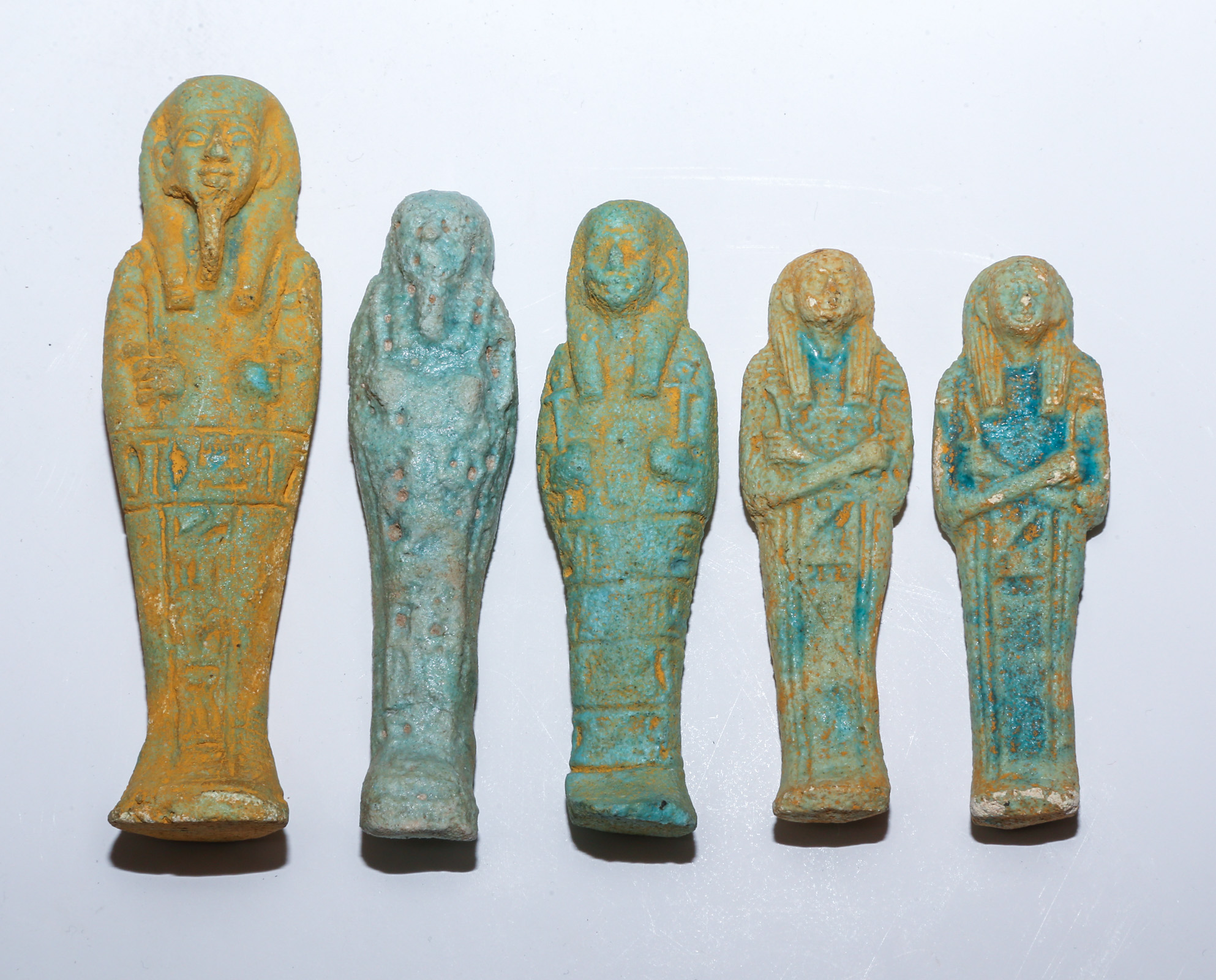 FIVE EGYPTIAN FAIENCE USHABTI FIGURES