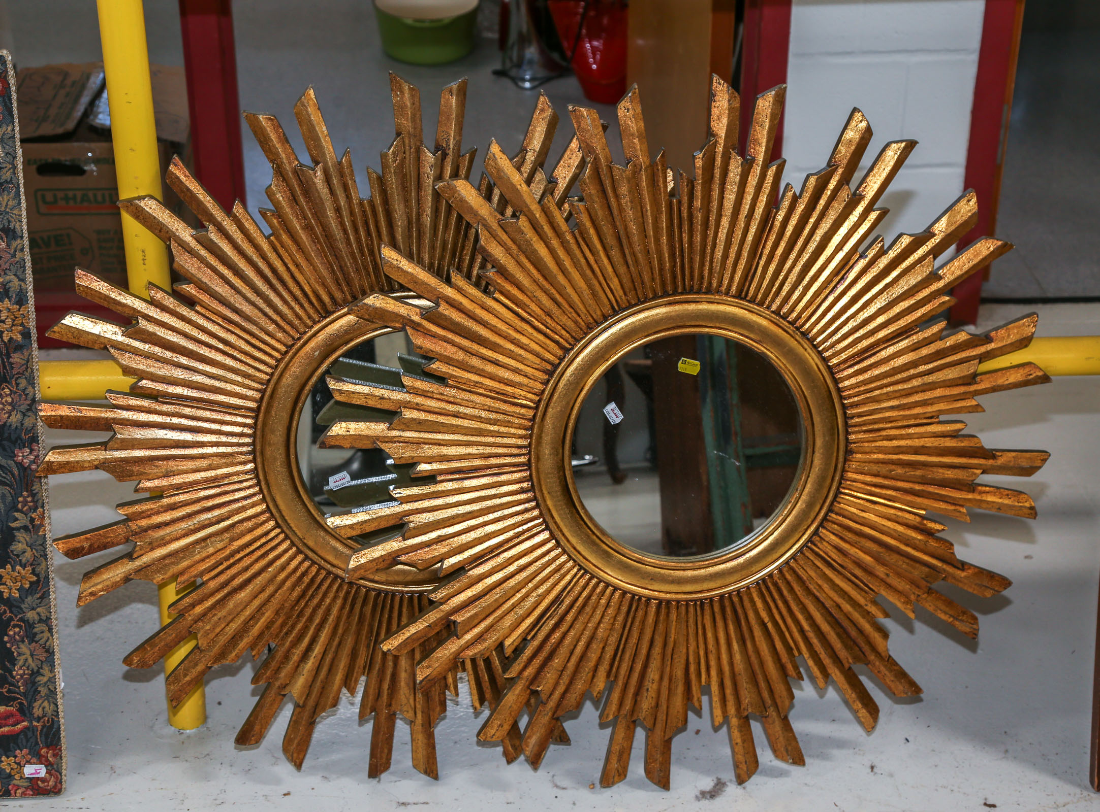 A PAIR OF ROUND MIRRORS IN SUNBURST