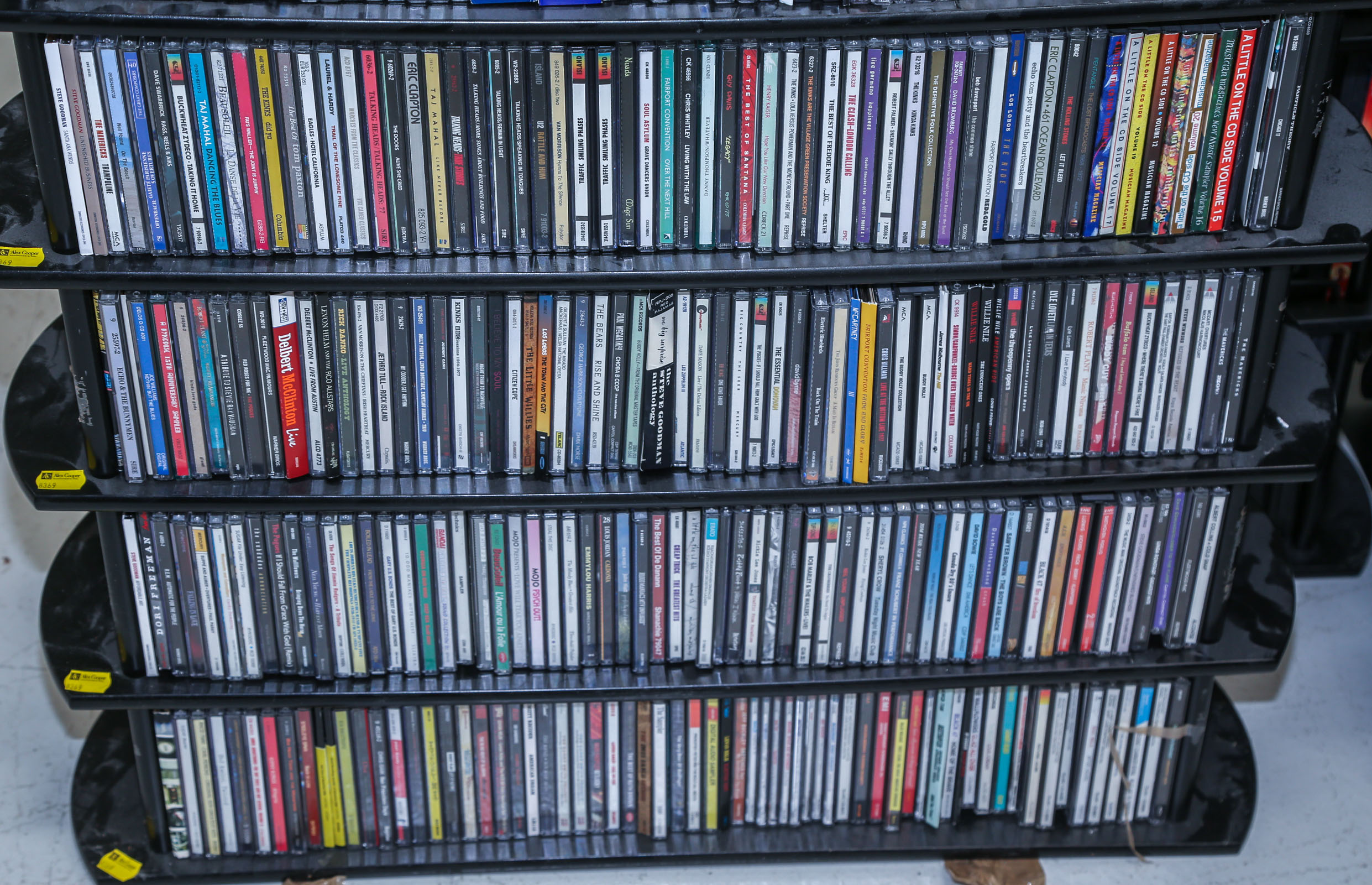 FOUR SHELVES OF MUSICAL CDS Comprising
