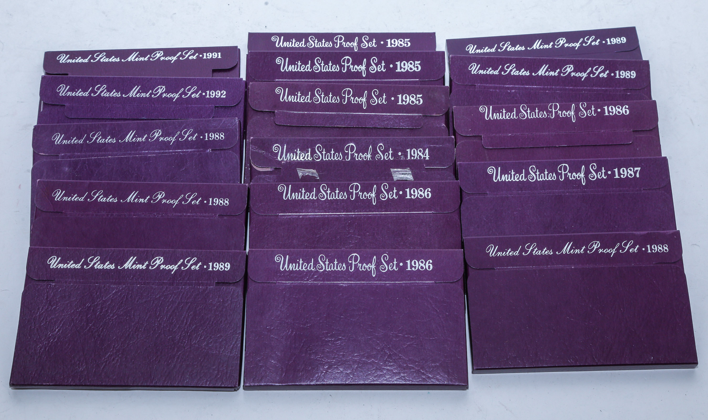 BOX OF 16 MAROON BOXED PROOF SETS 1984-92