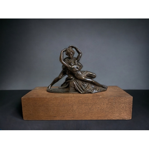 A BRONZE FIGURE GROUP OF CUPID 3c93ff