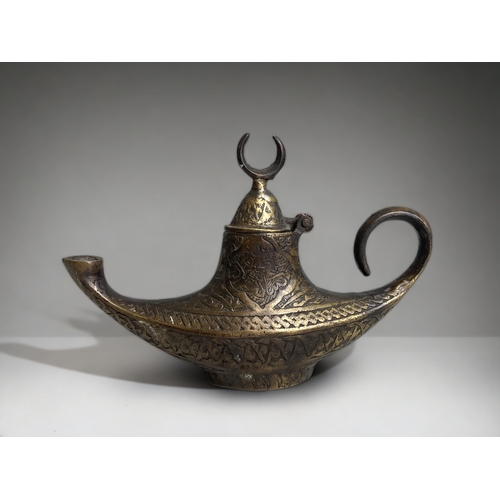 A TURKISH BRONZE 'GENIE' OIL LAMP.20