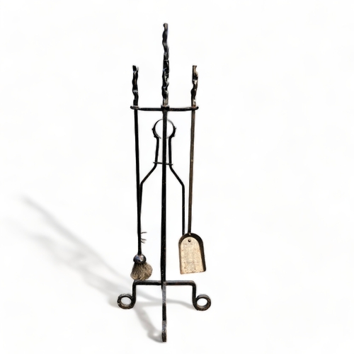 Antique iron fireside set on stand.