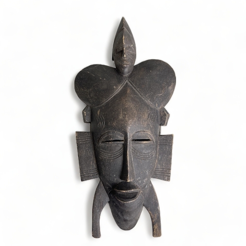 West African carved Kpelie mask,