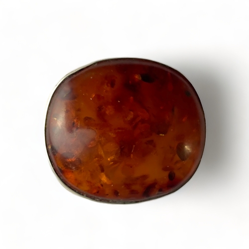 A Silver and Baltic amber oval brooch,