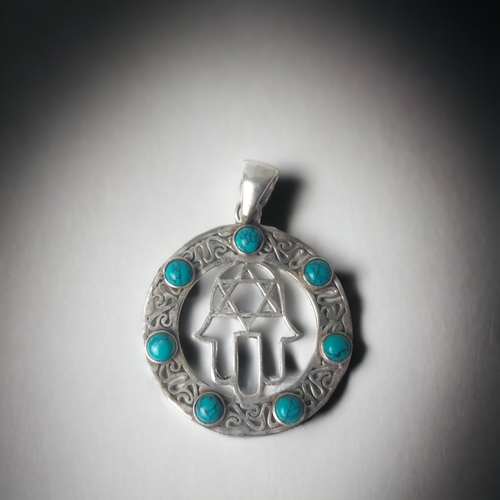 A SILVER FILIGREE HAND OF MIRIAM PENDANT.