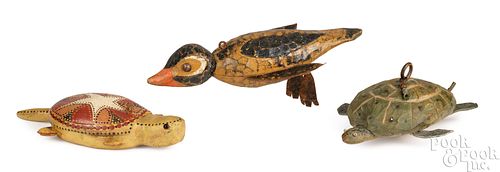 THREE CARVED AND PAINTED FISH DECOYSThree 3c9e01