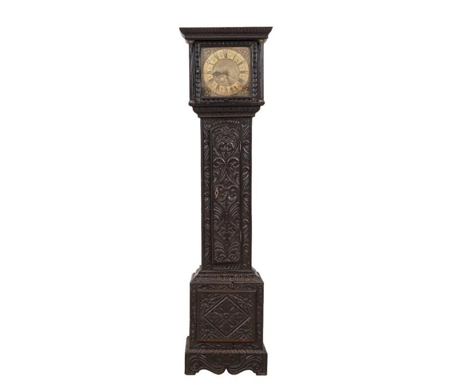 Carved oak tall case clock signed