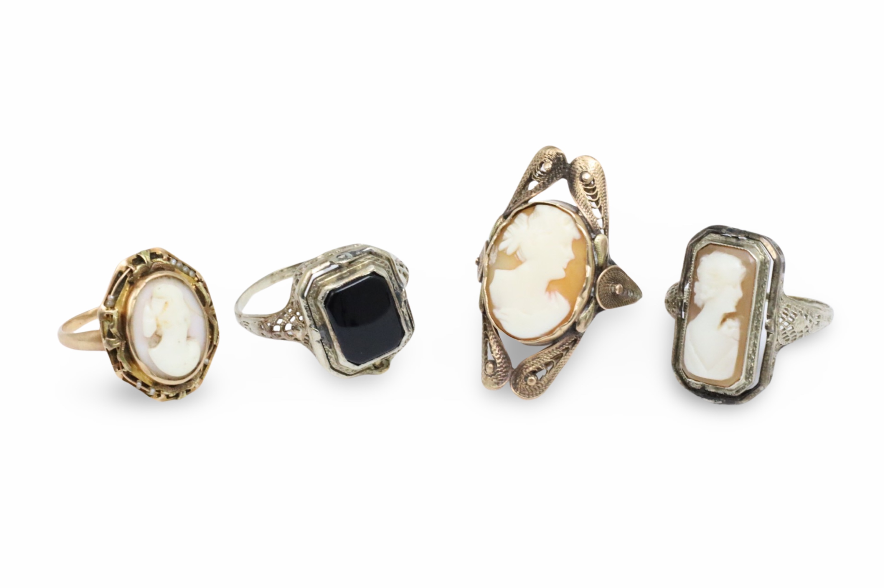 FOUR CAMEO AND SWIVEL RINGS Group