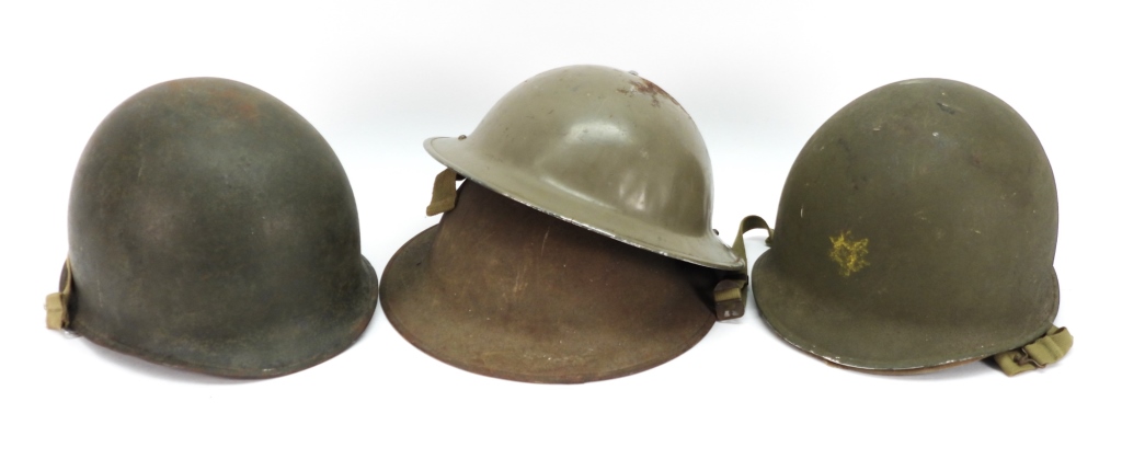 GROUP OF FOUR MILITARY HELMETS 3ccdfe
