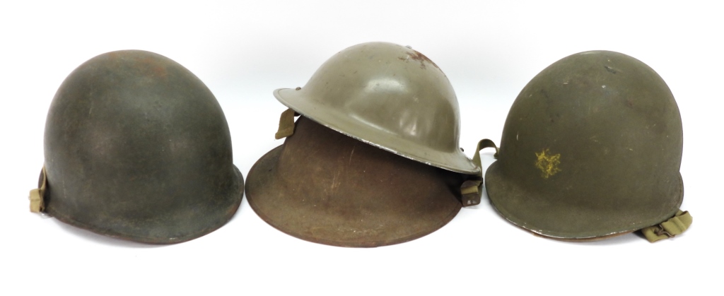 GROUP OF FOUR MILITARY HELMETS ,An M1