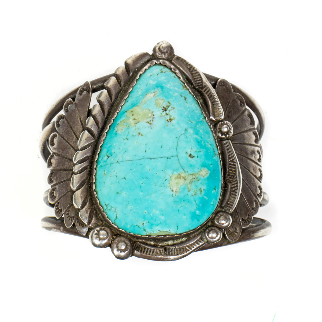 A NAVAJO TURQUOISE CABOCHON AND STERLING