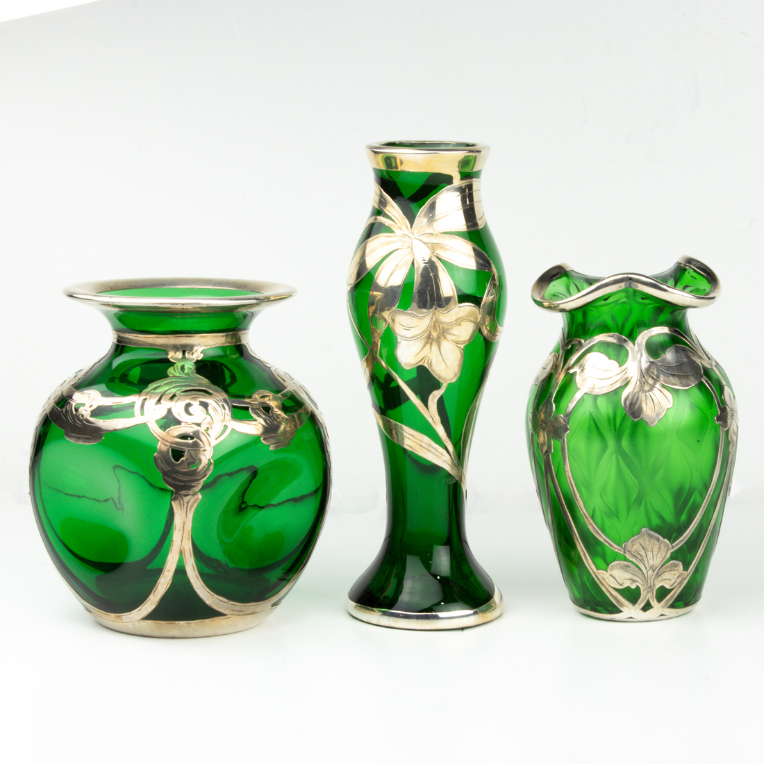 THREE ART NOUVEAU GREEN GLASS VASES,