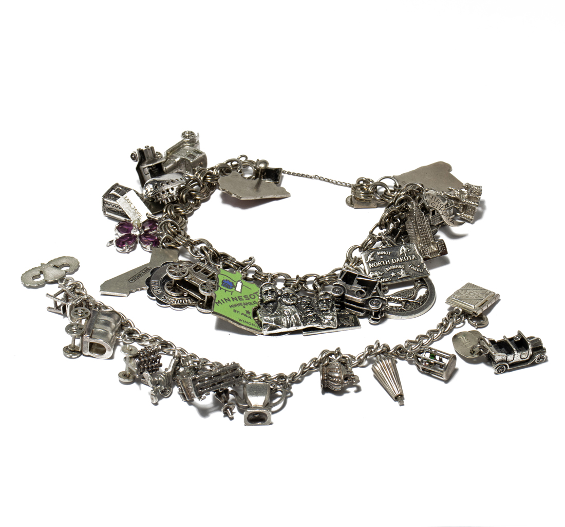 TWO STERLING CHARM BRACELETS: THE