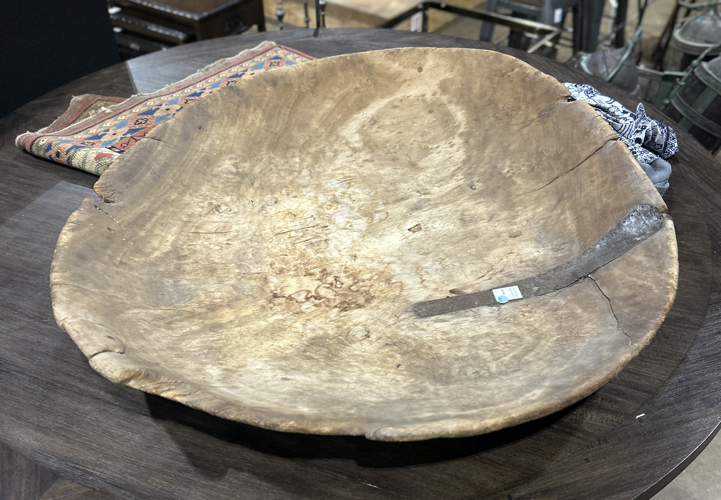 A LARGE TURNED WOOD BOWL WITH METAL