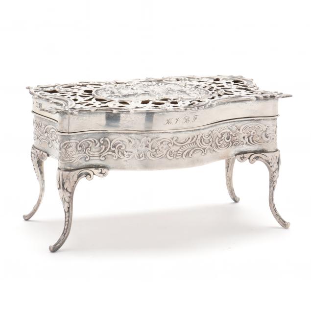 AN EDWARDIAN SILVER DRESSER BOX,