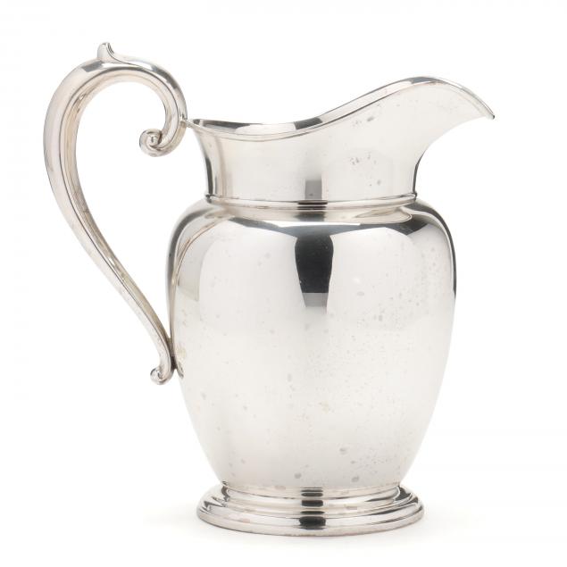A STERLING SILVER WATER PITCHER
