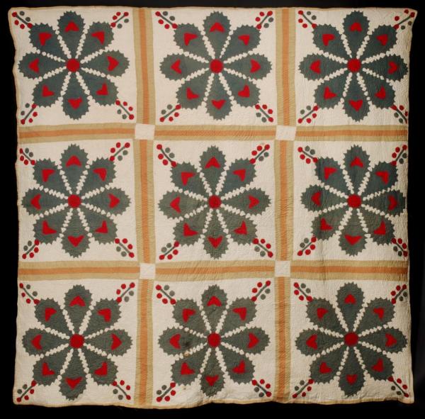 A 19TH CENTURY HOLLY MOTIF APPLIQUE